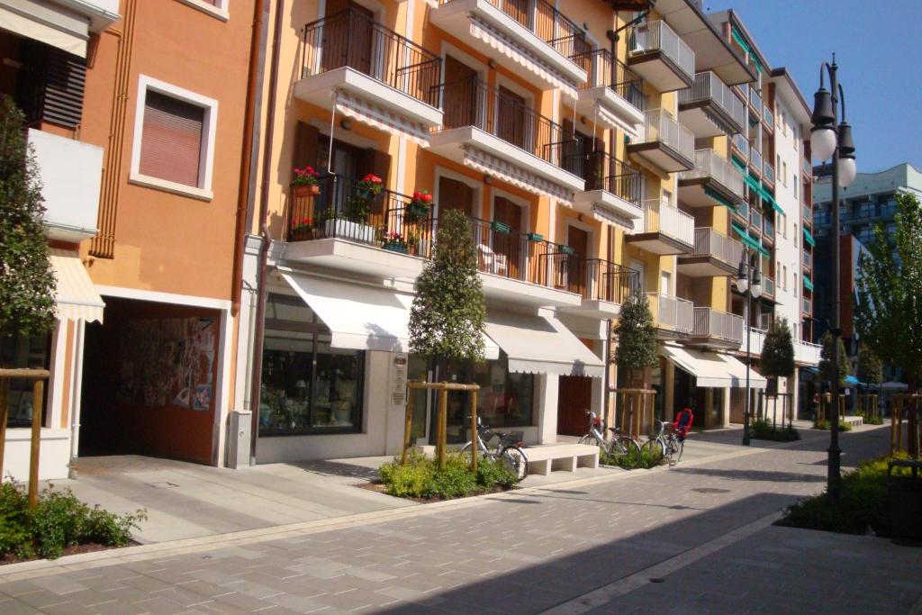 a street in a city with a building at Condominio Alto Adriatico in Grado