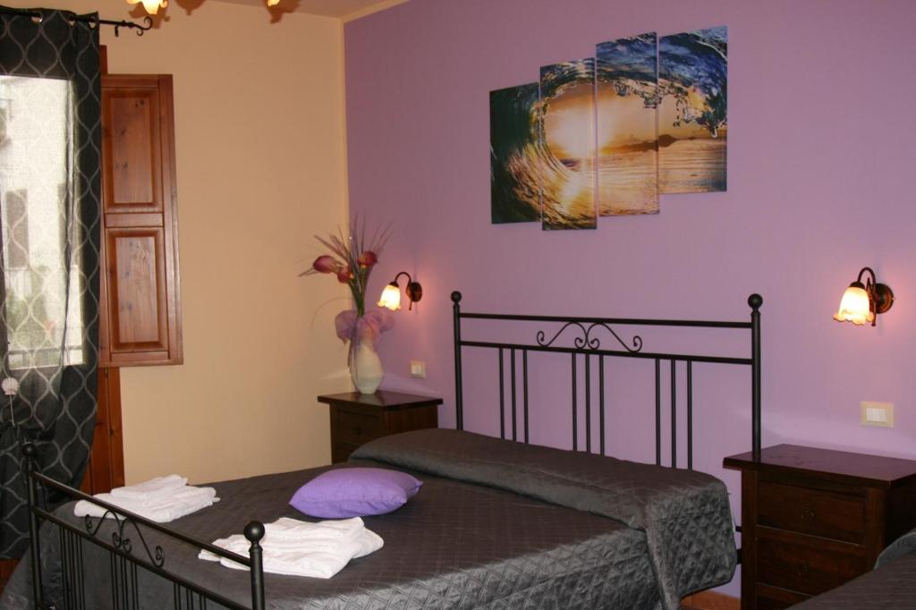 Postel nebo postele na pokoji v ubytování Hotel Il Cortile