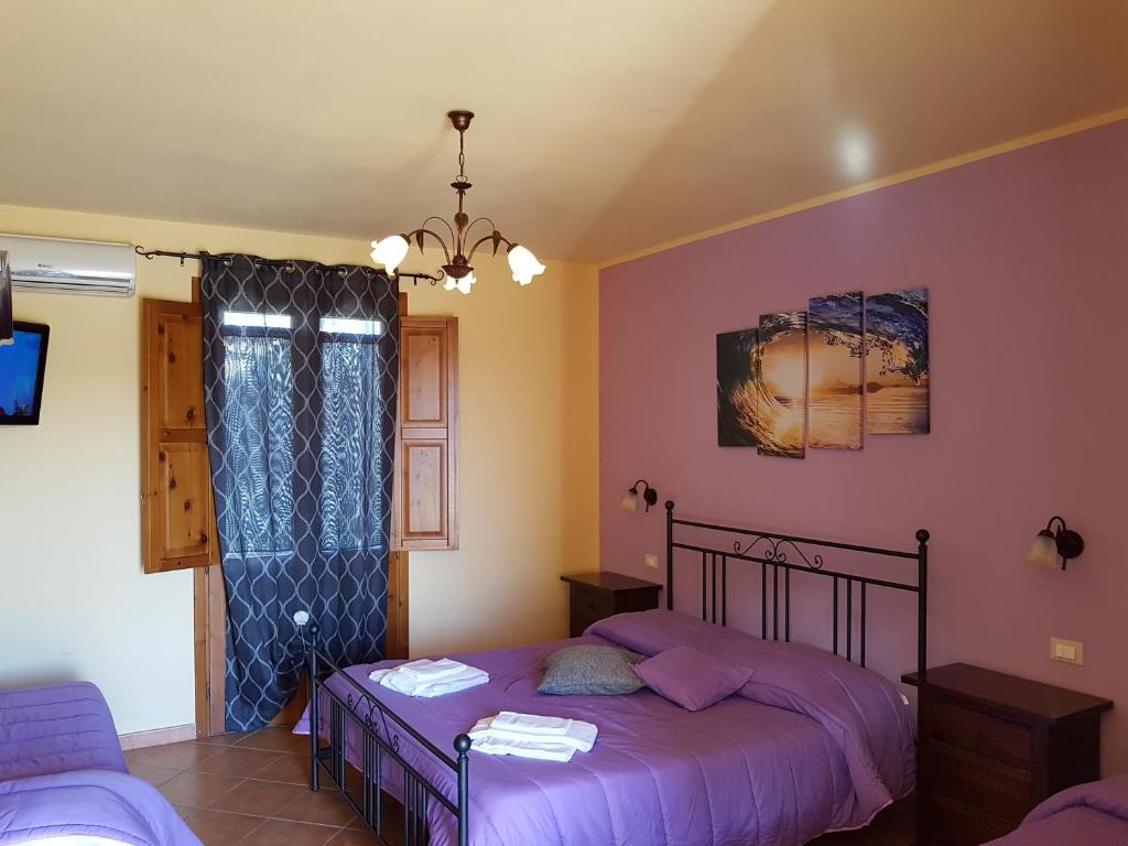 Postel nebo postele na pokoji v ubytování Hotel Il Cortile