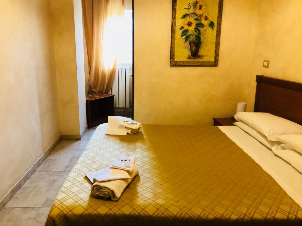 Postel nebo postele na pokoji v ubytování Hotel Casarola - Trigoria