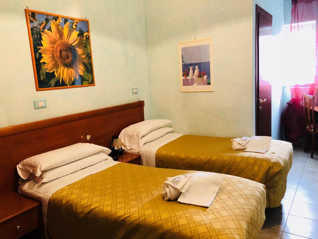Postel nebo postele na pokoji v ubytování Hotel Casarola - Trigoria