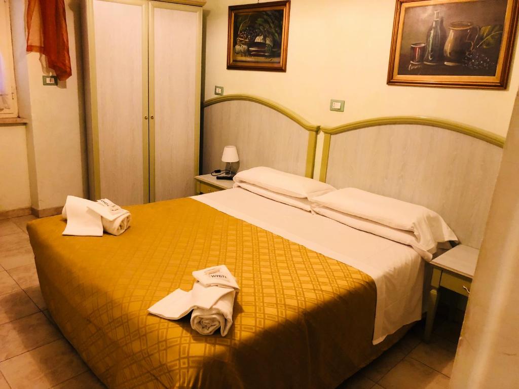 Postel nebo postele na pokoji v ubytování Hotel Casarola - Trigoria