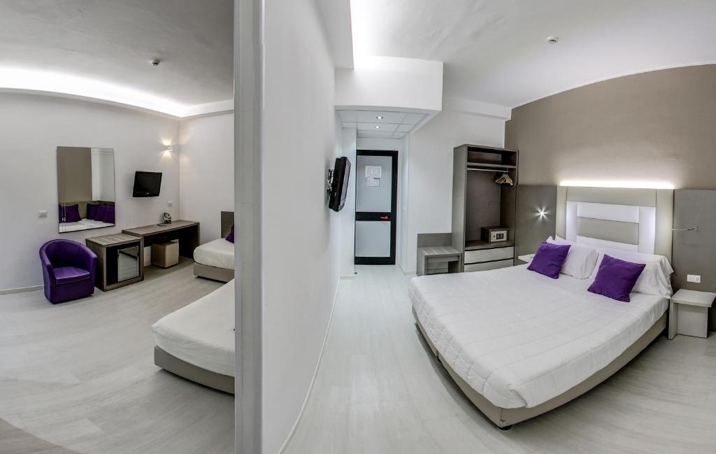 Postel nebo postele na pokoji v ubytování Hotel Boemia