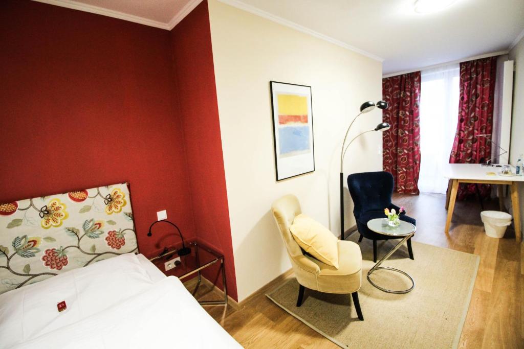 Postel nebo postele na pokoji v ubytování das kleine Hotel in München