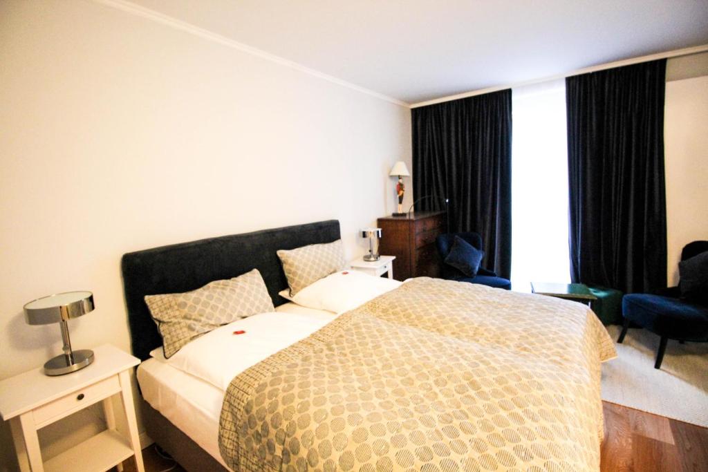 Postel nebo postele na pokoji v ubytování das kleine Hotel in München