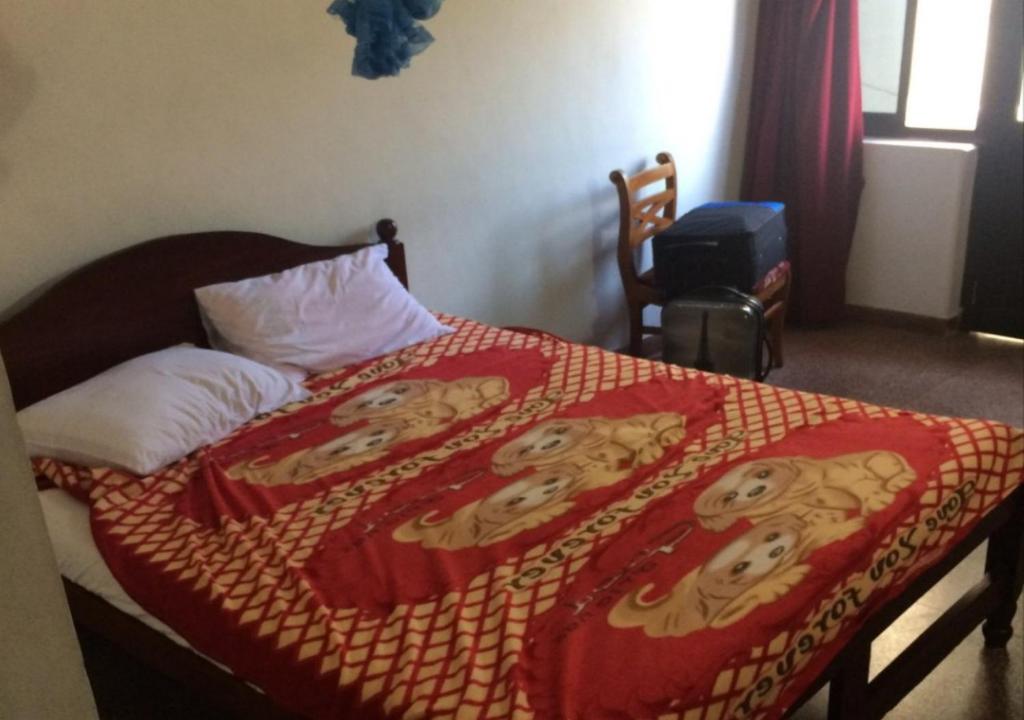Postel nebo postele na pokoji v ubytování Majestic Tourist Hotel
