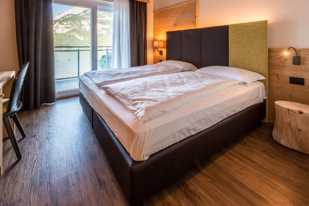 Postel nebo postele na pokoji v ubytování Hotel Fontanella