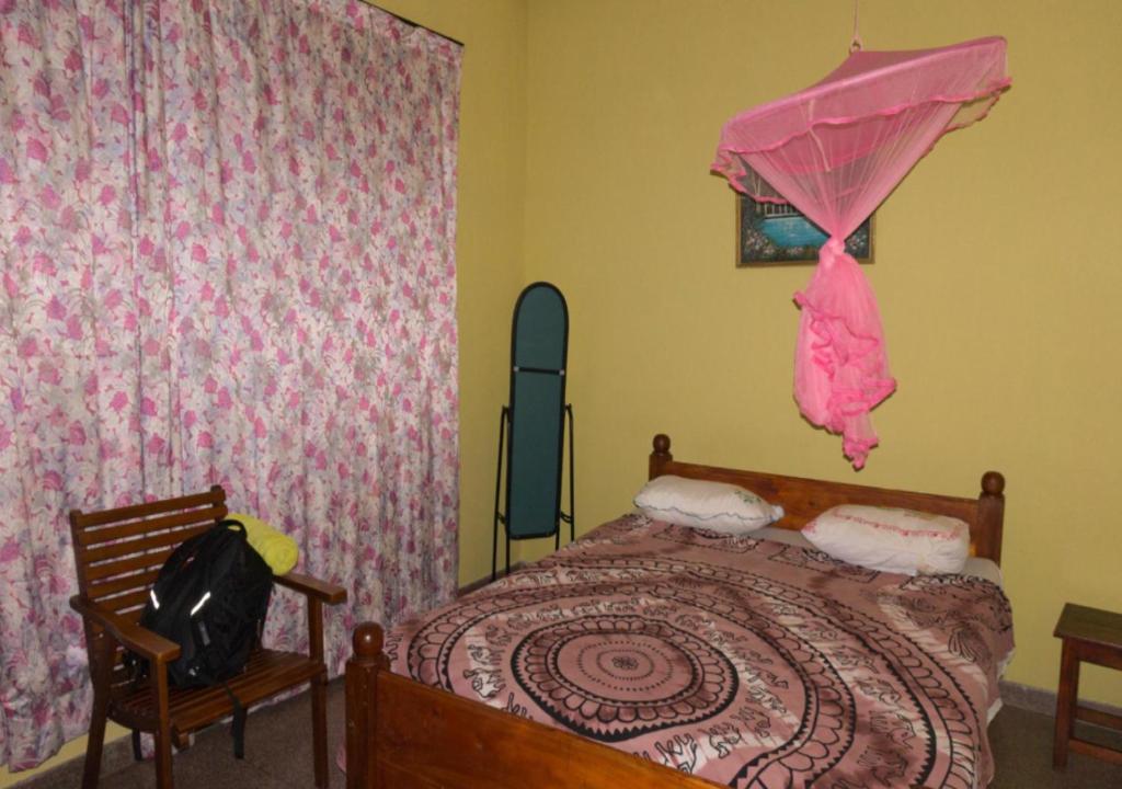 Postel nebo postele na pokoji v ubytování Majestic Tourist Hotel