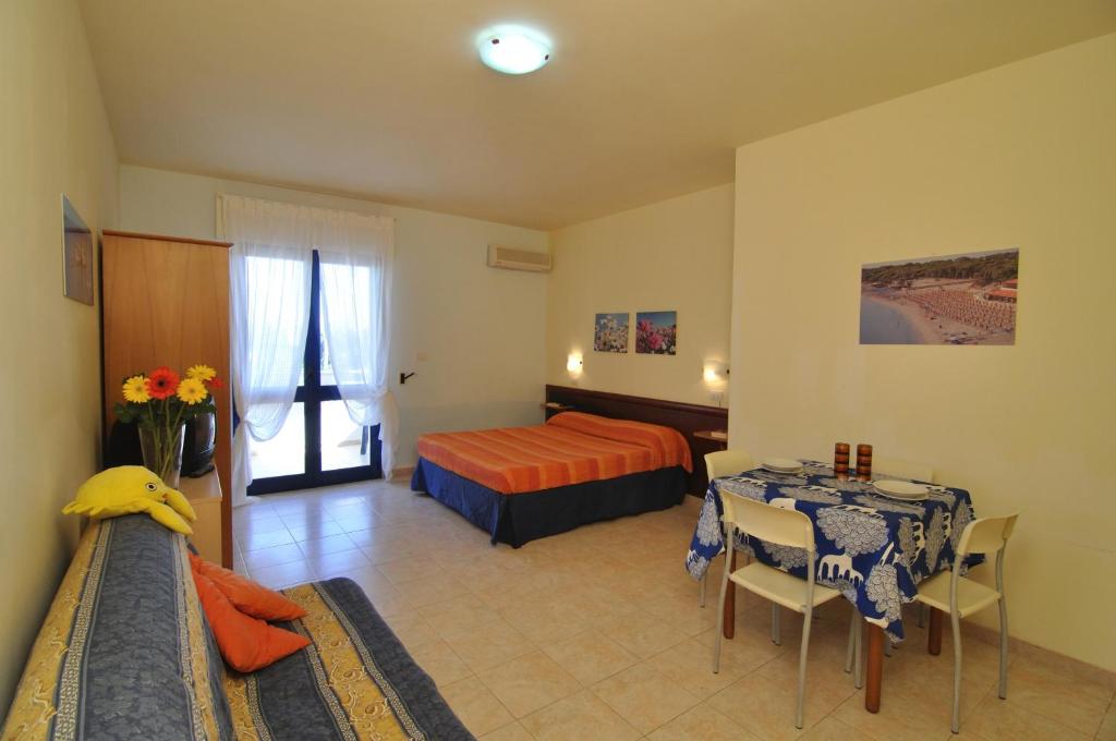 Postel nebo postele na pokoji v ubytování Residence Oasi Salento