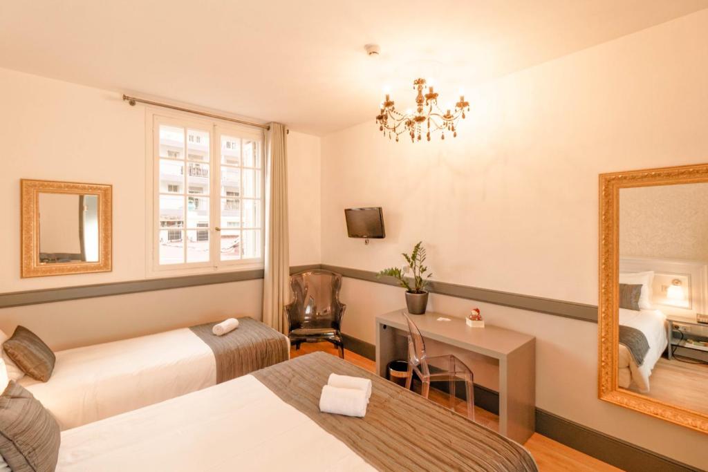 Postel nebo postele na pokoji v ubytování Hotel Restaurant Edmond's