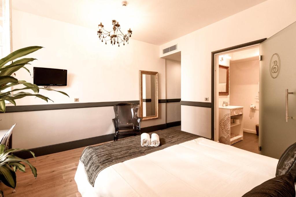 Postel nebo postele na pokoji v ubytování Hotel Restaurant Edmond's