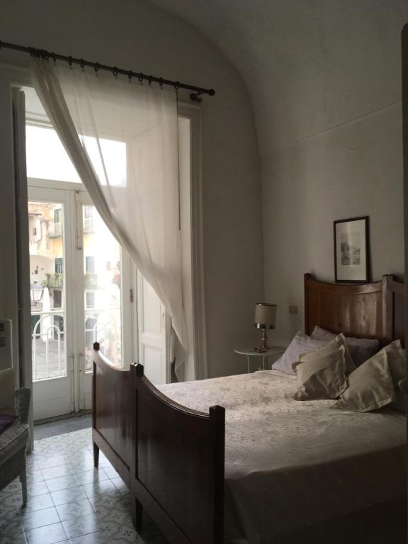 A bed or beds in a room at Casa Letizia Amalfi Coast