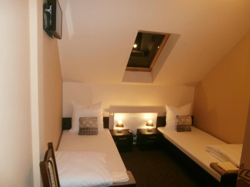 Posteľ alebo postele v izbe v ubytovaní Sum Restauracja & Hotel