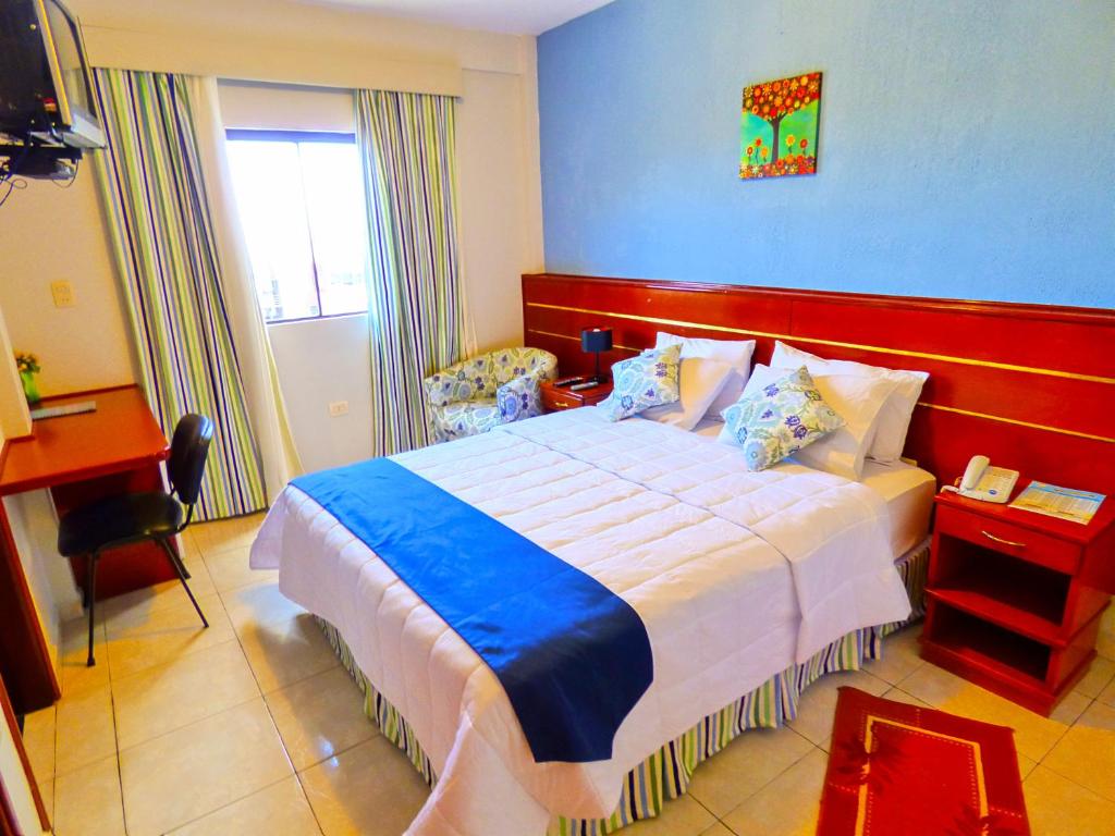 Postel nebo postele na pokoji v ubytování De La Costa Hotel