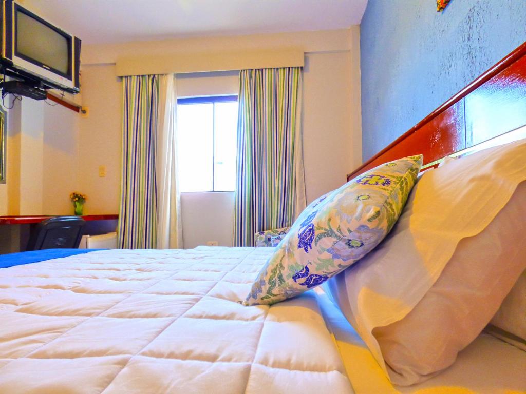 Postel nebo postele na pokoji v ubytování De La Costa Hotel