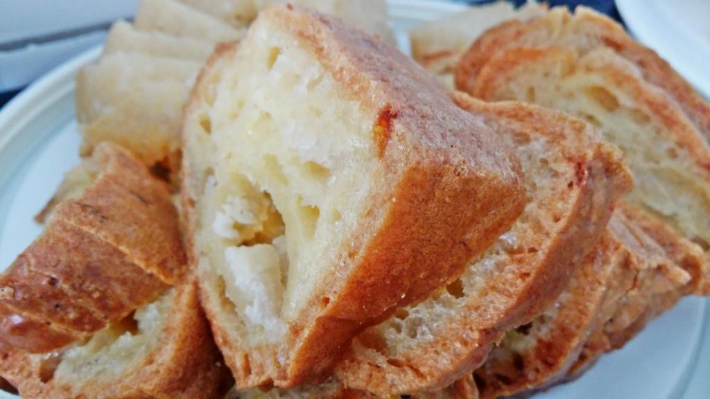 a white plate with two slices of bread on it at Pousada Beira Rio Parnaíba in Parnaíba