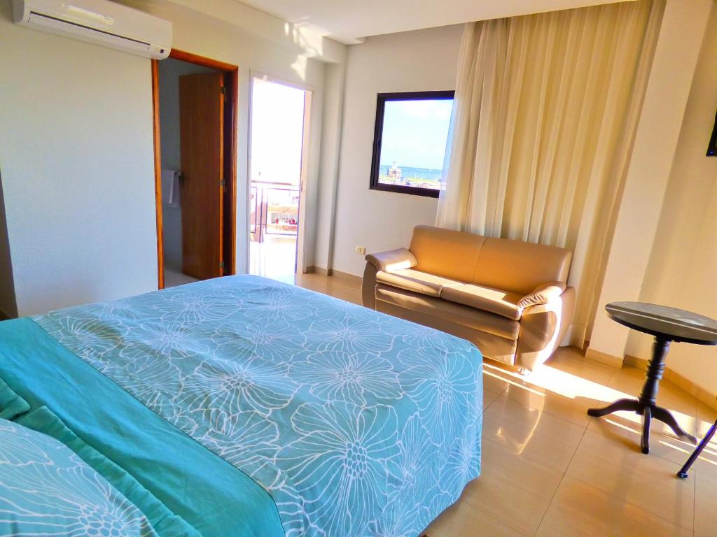 Postel nebo postele na pokoji v ubytování De La Costa Hotel