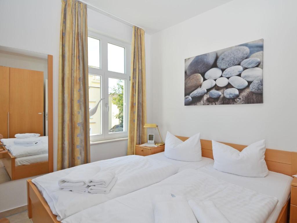 Postel nebo postele na pokoji v ubytování Haus Möwe - Apt. 03
