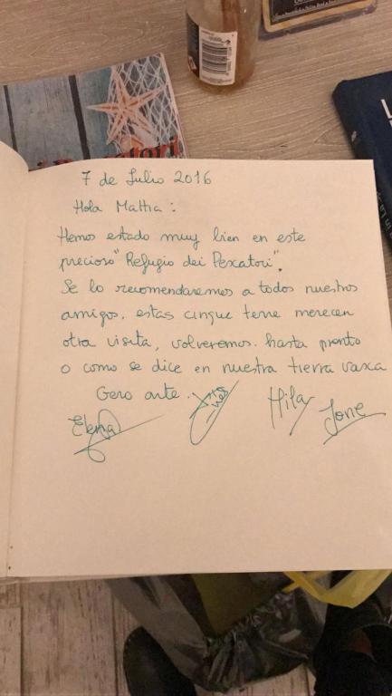 a handwritten letter on a piece of paper at Rifugio dei Pescatori in Riomaggiore