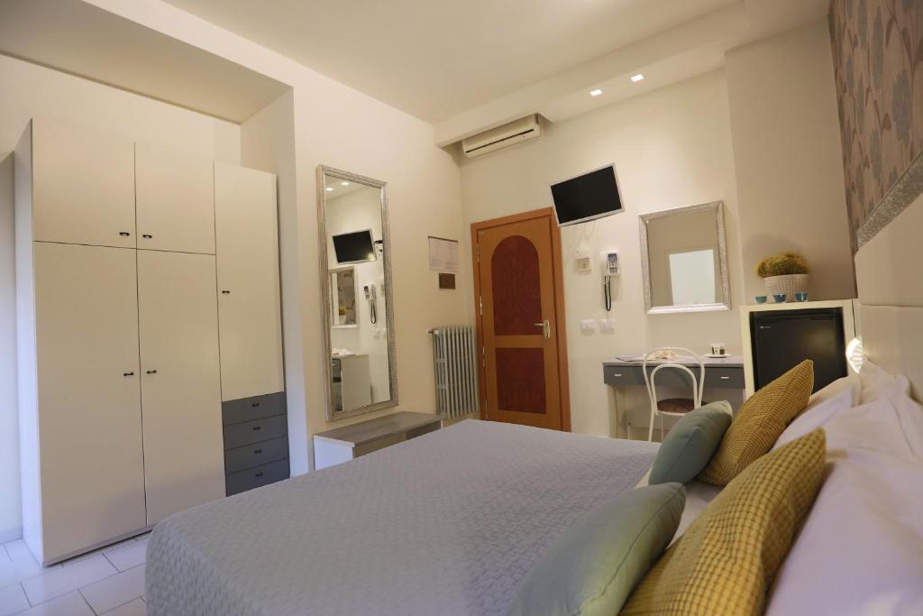 Postel nebo postele na pokoji v ubytování ELISABETTA hotel