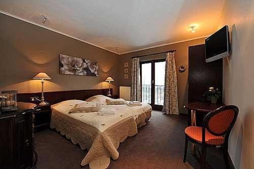 Postel nebo postele na pokoji v ubytování Hostellerie Au Vieux Hetre