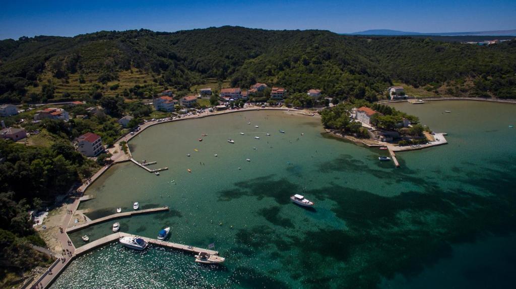 an aerial view of a harbor with boats in the water at Apartmani Premijer-Rab in Supetarska Draga