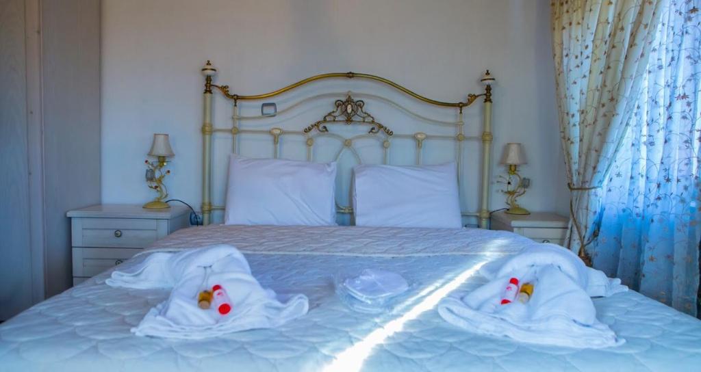 Posteľ alebo postele v izbe v ubytovaní Guesthouse Tsegani