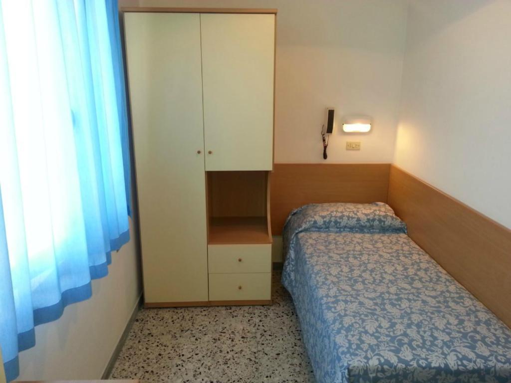 A bed or beds in a room at Hotel Irene