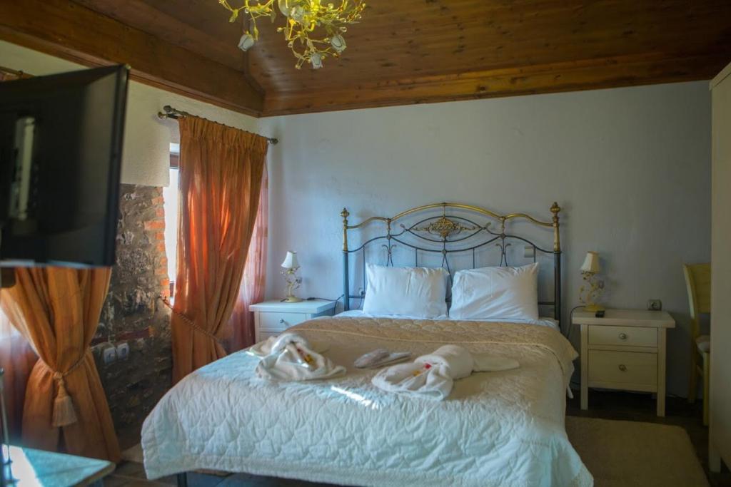 Posteľ alebo postele v izbe v ubytovaní Guesthouse Tsegani