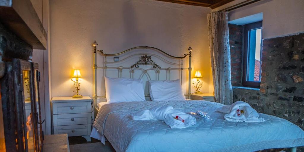 Posteľ alebo postele v izbe v ubytovaní Guesthouse Tsegani