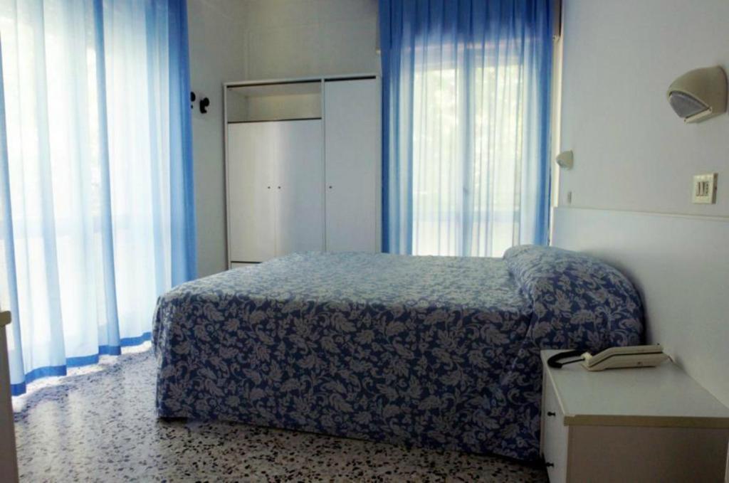 A bed or beds in a room at Hotel Irene
