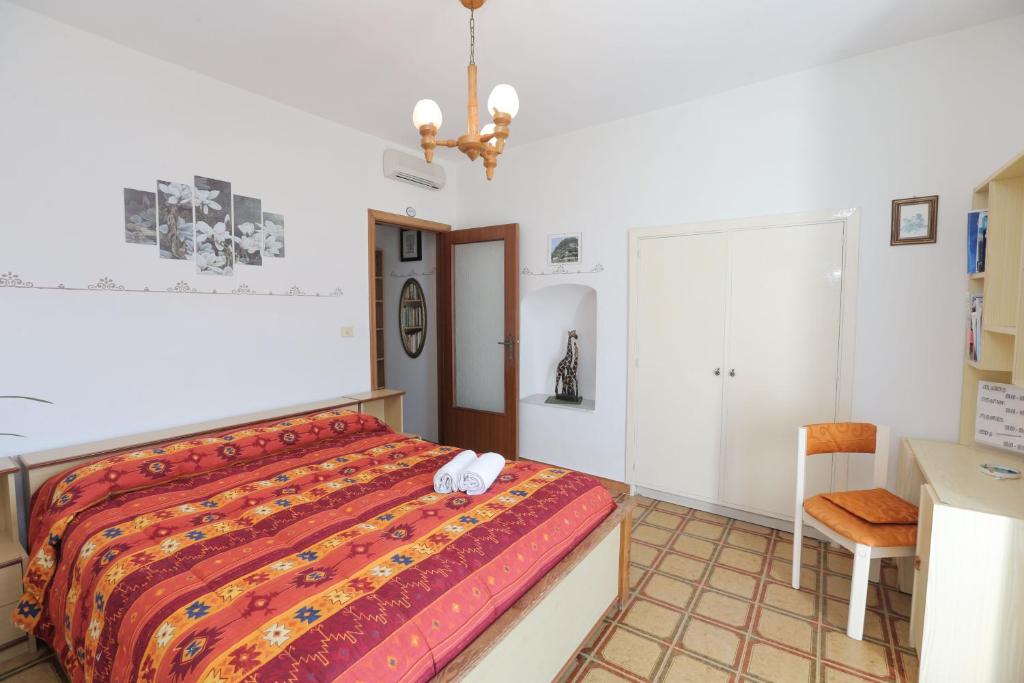 Łóżko lub łóżka w pokoju w obiekcie Villa Marietta