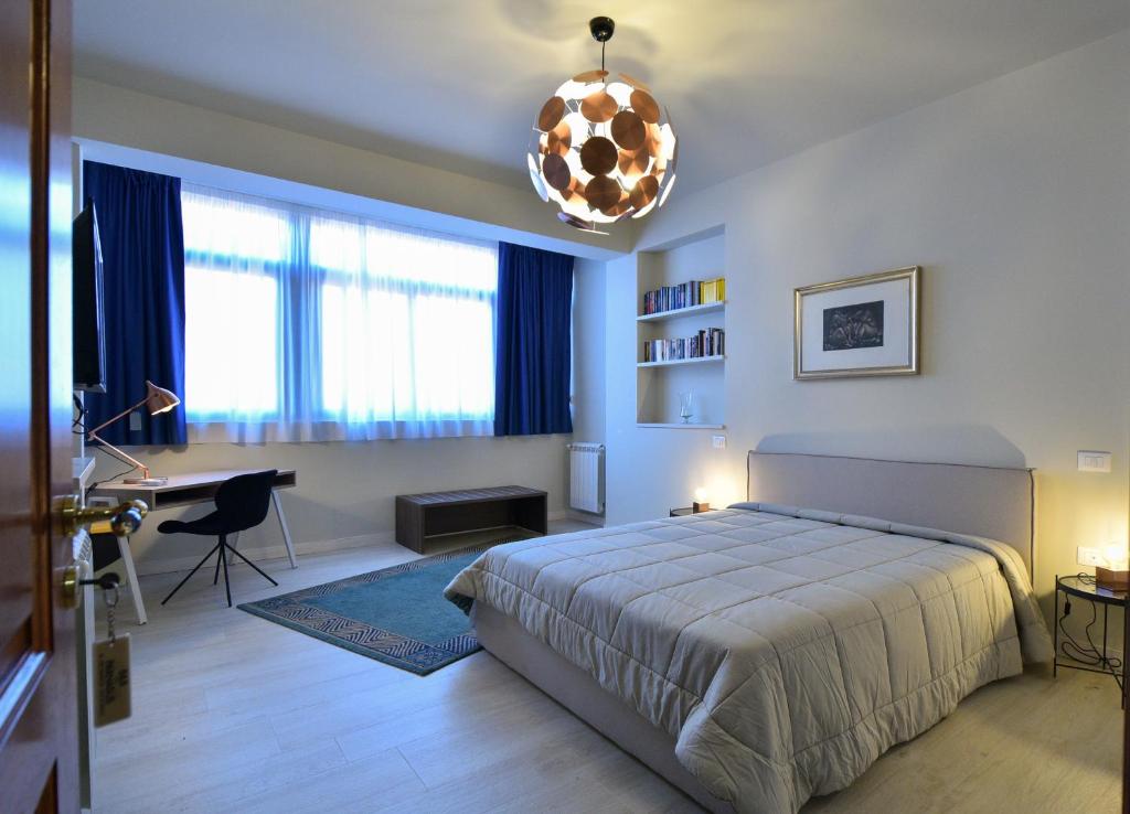 A bed or beds in a room at Parnasus