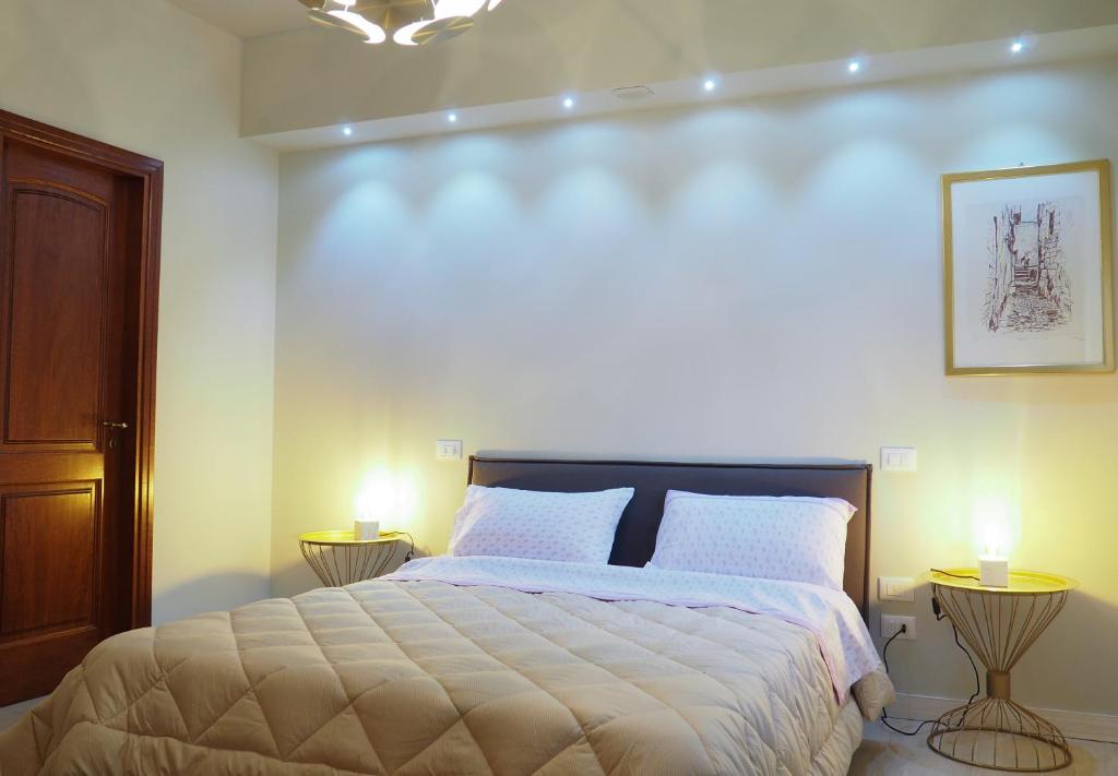A bed or beds in a room at Parnasus