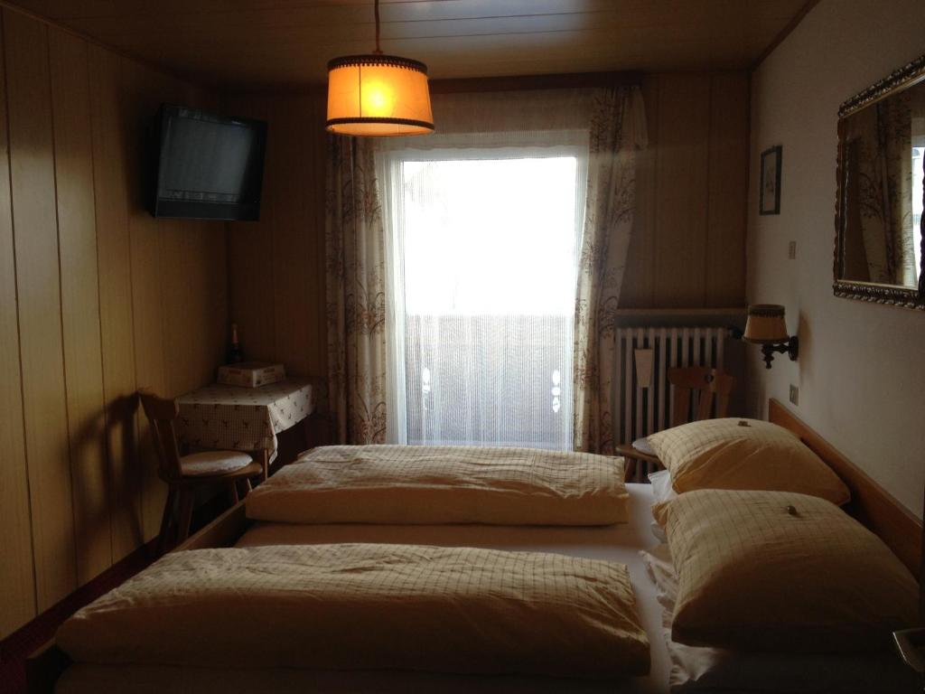 Postel nebo postele na pokoji v ubytování Garni Sayonara
