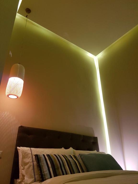 Łóżko lub łóżka w pokoju w obiekcie B&B NAPOLI AMORE MIO