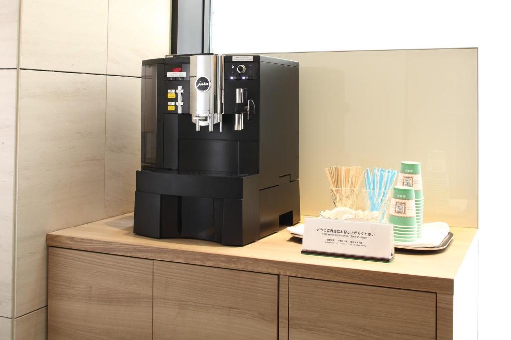 a coffee machine sitting on top of a counter at Tokyu Stay Kamata - Tokyo Haneda in Tokyo