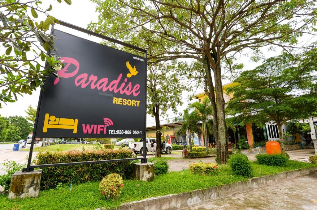 a sign for a parkilla resort on a street at Paradise Resort in Pattaya North