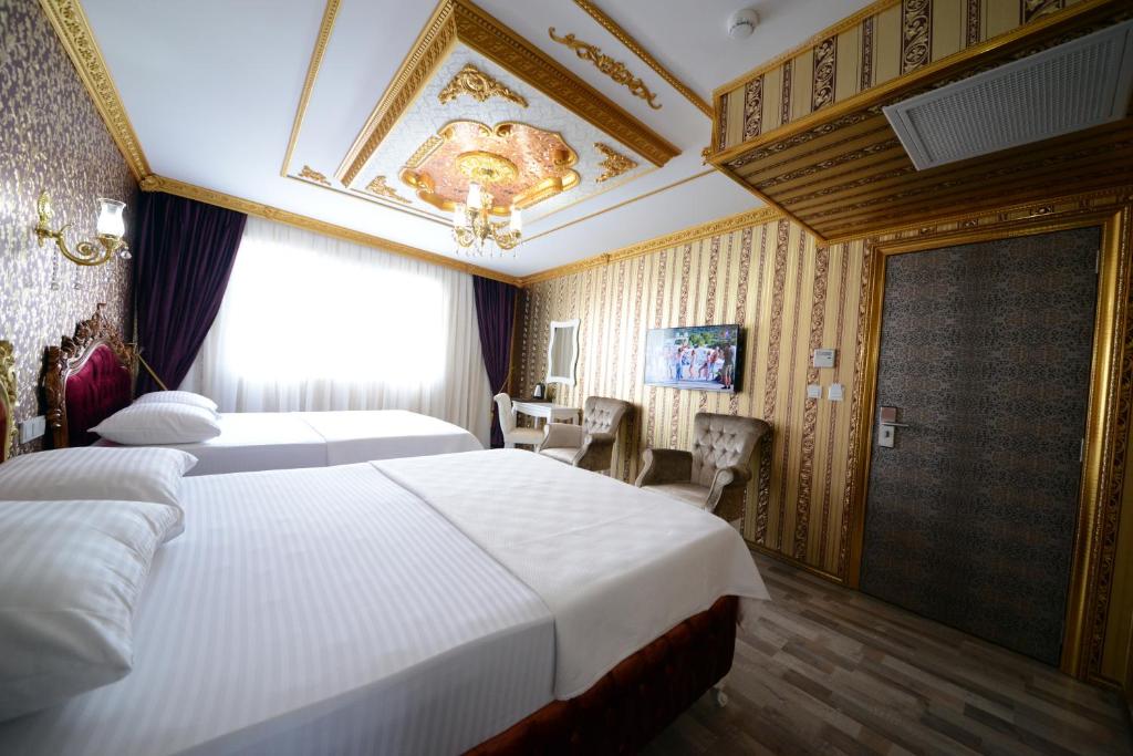 Postel nebo postele na pokoji v ubytování Fatih Babel Park Hotel