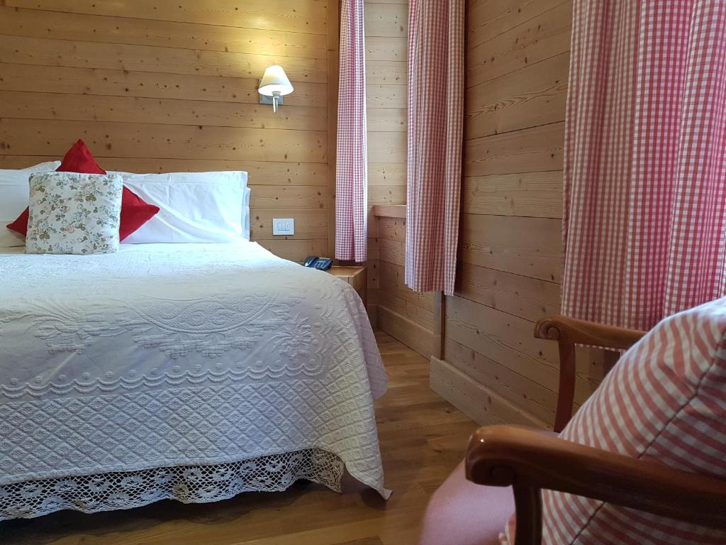 Postel nebo postele na pokoji v ubytování Hotel Pedretti