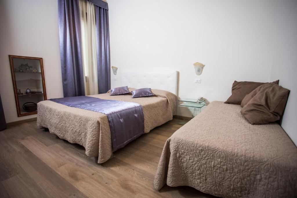 Postel nebo postele na pokoji v ubytování Locanda Ca' Lucrezia