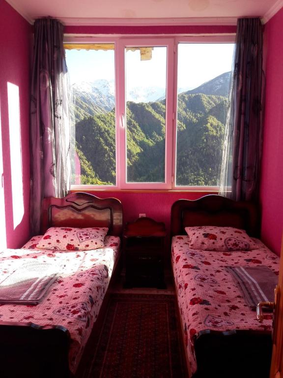 Postel nebo postele na pokoji v ubytování Betegi Guest House