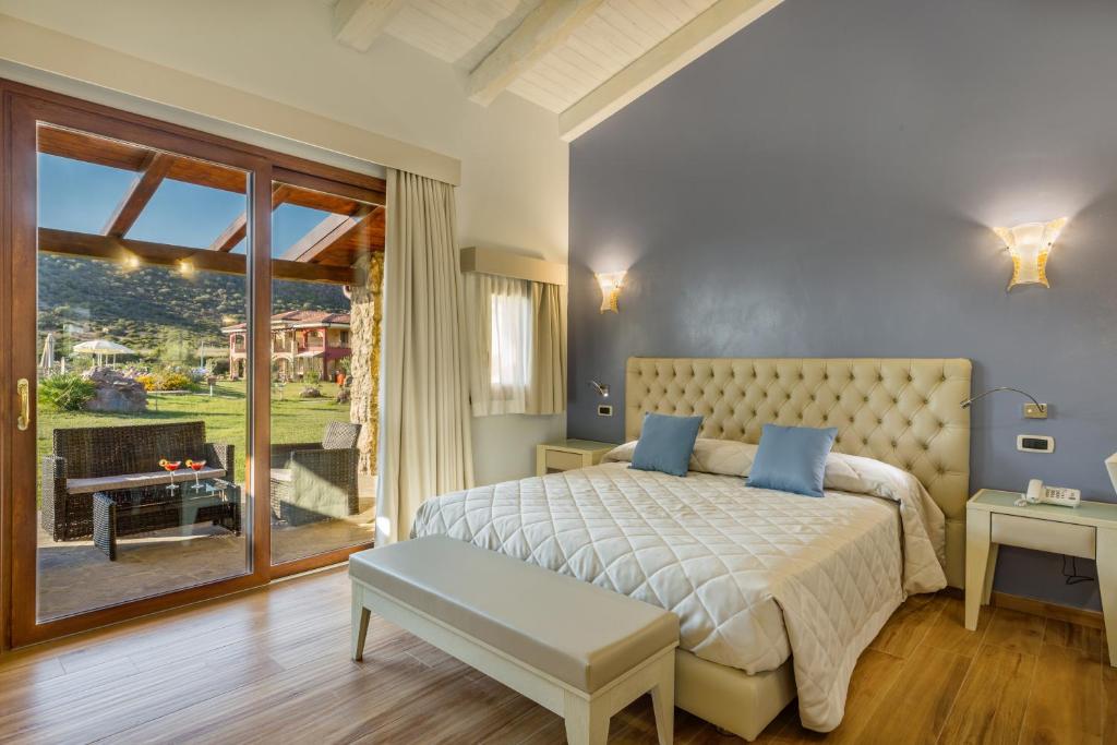 Postel nebo postele na pokoji v ubytování Hotel Sa Cheya Relais & Spa