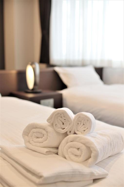 Postel nebo postele na pokoji v ubytování Bande Hotel Osaka