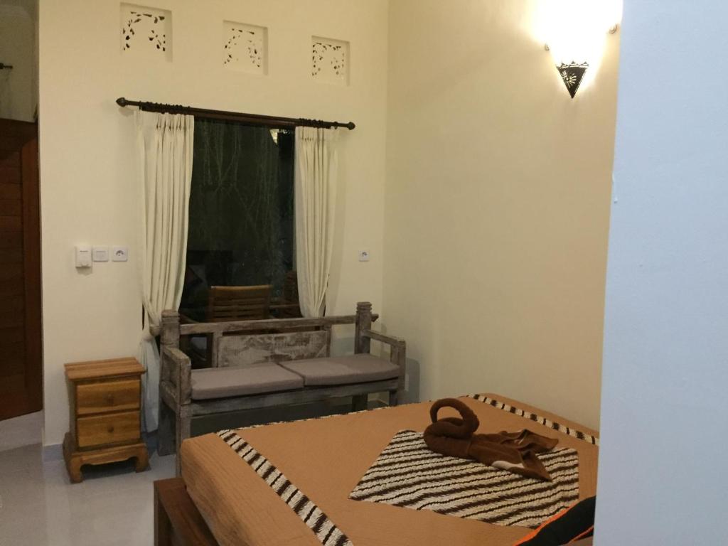 Postel nebo postele na pokoji v ubytování Blima Bali