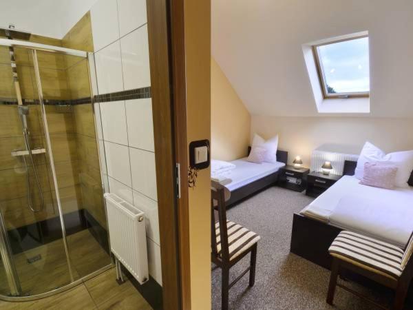 Posteľ alebo postele v izbe v ubytovaní Sum Restauracja & Hotel