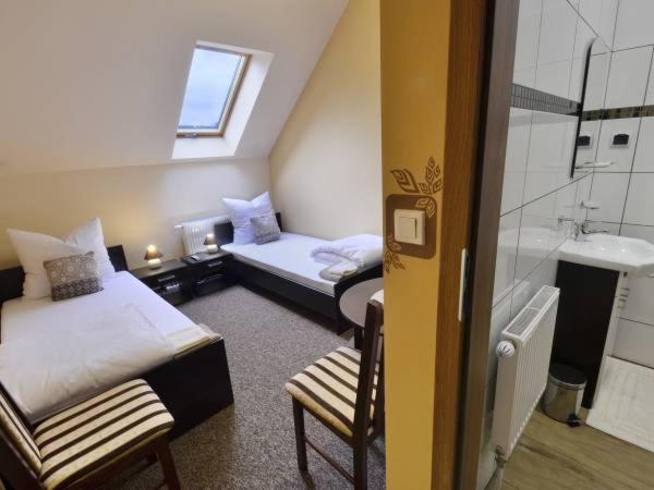 Posteľ alebo postele v izbe v ubytovaní Sum Restauracja & Hotel