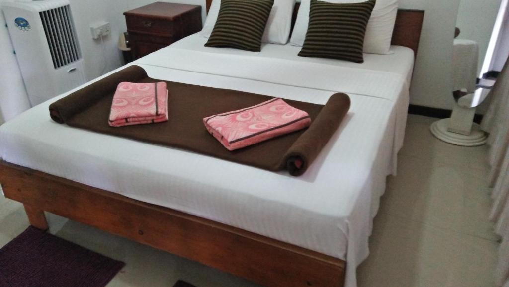 Postel nebo postele na pokoji v ubytování 59B Rest Inn Ella