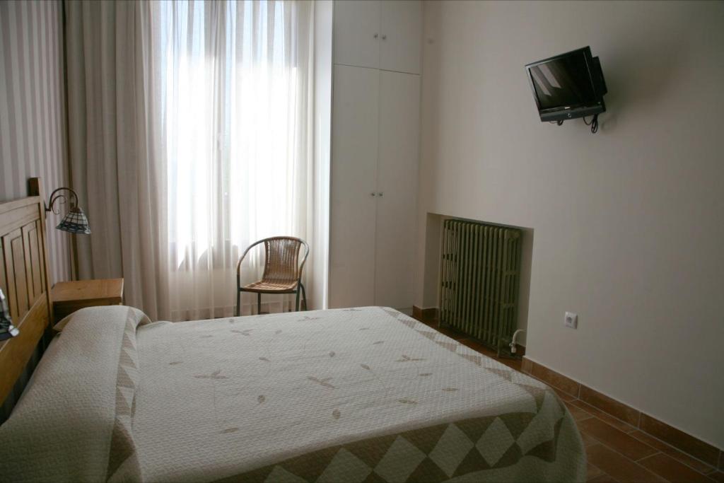 Postel nebo postele na pokoji v ubytování Hostal La Fuente