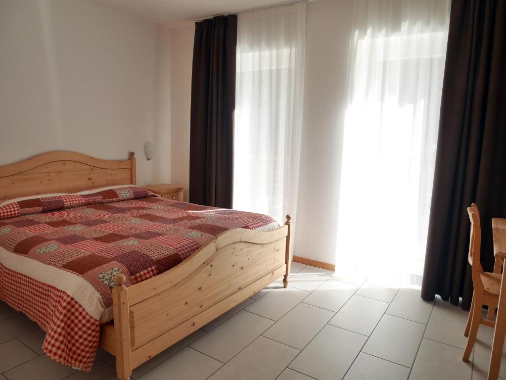 Postel nebo postele na pokoji v ubytování Hotel Elbele Garnì